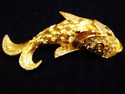 Up for sale I have a very nicely designed large Christian Dior fish rhinestone pin. This pin is like in new condition....