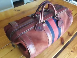 Age worn, great condition. Zipper works perfectly. Lock and key are original, key has a real leather pouch. Snap works...