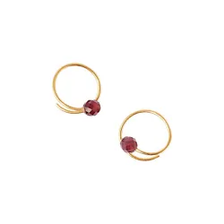 A unique earring you didnt know you needed! You wont want to take these Chan Luu Faceted Garnet Eternal Spiral Huggie...