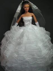 For sale is a handmade NEW wedding dress for Barbie Dolls with veil and a pair of gloves.