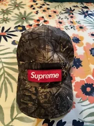 This vintage camo hat from Supreme is a unique addition to any wardrobe. The hat features a colorful design with a mix...