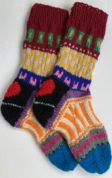 One pair of HOMEMADE HAND KNIT MULTI COLORED SOCKS with HEART ON HEEL Woman Size 7-8 1/2. The socks measure 10...