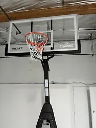 Basketball hoop with a professional-sized backboard and adjustable height. Already assembled. Retails for $1600-$2100...