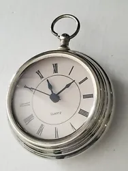 Alarm clock in the shape of an old pocket watch, Quartz made in China Untested. Very heavy for its size Great packaging...
