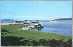 This vintage postcard features the charming town of Fish Creek, Wisconsin with its beautiful pleasure boats and docks....