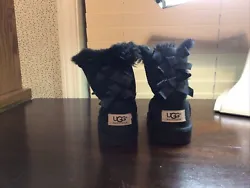 UGG BLACK BAILEY BOW SUEDE/ SHEEPSKIN BOOTS, TODDLER GIRL US Size 7. Condition is Pre-owned. Shipped with USPS Priority...