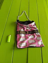 Versace pink drawstring bag.