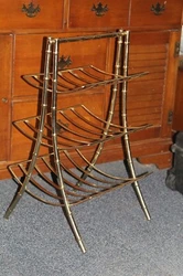 This vintage magazine rack stand is a stunning addition to any home decor. Made of sturdy metal and finished in a...