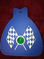 MUDFLAP IN BLUE WITH BLUE & WHITE CHECKERED CROSS FLAGS AND RED JEWEL. YOU GET ONE MUDFLAP IN BLUE. WITH CHECKERED...