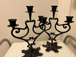 Nice heavy iron candle holders measure 11 1/2” in height and 9” from side to side. In nice condition with minimal...