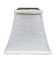 Finely tailored white linen hardback shade. Square Bell design features vertical piping and matching trim....