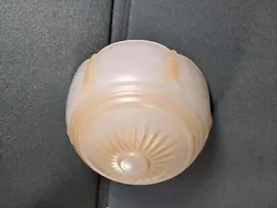 This is a single nice antique glass globe. Amber tint accents.