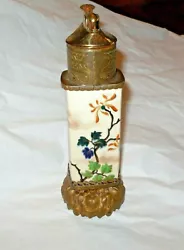 The body of the lighter is porcelain decorated in a distinctly Asian floral design including a graceful butterfly all...