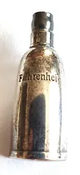 Pins pin bijou Parfum Christian DIOR Paris Fahrenheit argenté bon état taille 3 x 1,1 cms.