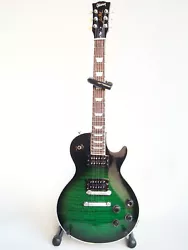 Qualité irréprochable, véritable réplique de la guitare Gibson Les Paul en finition « anaconda burst », une des...