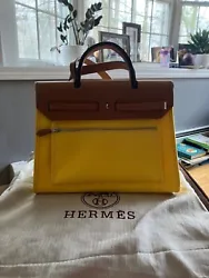 New authentic Hermes bag, beautiful yellow and brown. Never used.