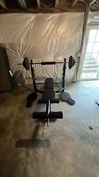 Used weight bench comes with 300lbs of weight 4x50lb, 2x25lb, 2x10lb, 6x5lbAlso has an extra straight bar for curls etc.