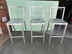 Three Emeco Stools Bar Height By Starck Pottery Barn Styled Chairs. Condition is Used. Shipped with USPS Priority Mail.