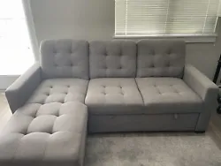2 seat couch with pull out bed. Reversible Chaise with storage attached. Chaise can go on either side. Used for just a...