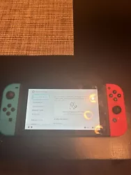 Used Nintendo Switch 32GB Handheld Console - Neon Red/Neon Blue. TV Dock included as well.