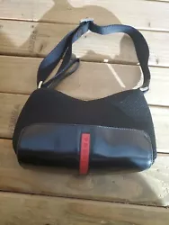 One prada handbag. I know nothing about these. Please check pictures for details. Appears to be in good condition.
