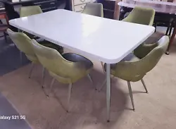 Set circa the 1960s. White Formica Table Top with Faux Marble Finish and Extra 18