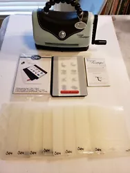 Sizzix Texture Boutique Embossing Machine w/12 Folders and Extra Embossing Pad.  This machine has hardly been used and...