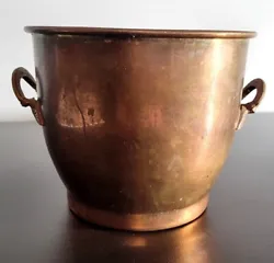 This antique vintage copper pot is a unique and beautiful addition to any collection. The pot features ornate handles...