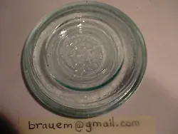 A nice ice blue CFJ Co. standard mouth quart fruit jar glass lid that reads: 