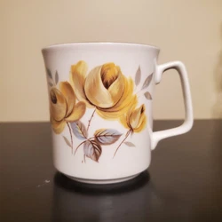 Vintage Royal Grafton Bone China Floral Coffee Cup. Mint condition no chips or cracks, no faded gold.