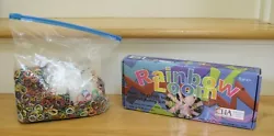 Rainbow loom with bag of assorted bands.