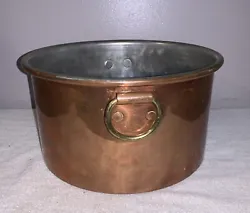 The copper pot is in nice condition with normal wear. It measures approximately 10 1/2” across the top and 6” high....