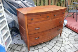 This solid wood dresser by the Paine Furniture Company (1835-1935) is in good condition given its age. It has no...