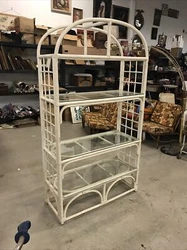 Tall rattan style shelf. This is being sold as is. It is still pretty sturdy but has a ton of cosmetic imperfections....