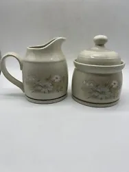 This Royal Doulton cream and sugar set in the Florinda pattern is a vintage piece from the 1980s. It features a...