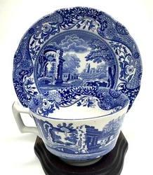 Spode Blue Italian Footed Cup and Sauce Made in England. The cup is about 2.5” tall and the saucer is about 6.25”...