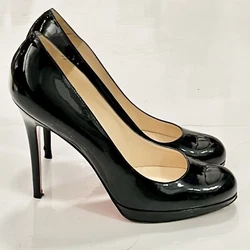 Coveted and classic Christian Louboutin black patent platform pumps. Small blemish on one heel. Lightly worn in great...