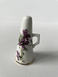 Beautiful candle snuffer has a wrap around violet design. Has gold paint detail on the top, bottom, and handle....