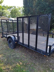 6 X 12 utility trailer, back and side ramps, used twice.