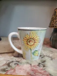 Beautiful sunflower mug with light blue background. Perfect for any garden/sunflower theme rooms/office, and makes the...
