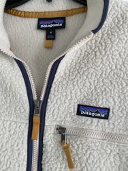 Full zip front with zip chest and hand pockets. Love the mustard color zip pulls! Preowned with light wear/pilling.