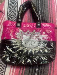pink and black hello kitty puffer purse. barely used. looks like new. (official sanrio)