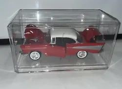 1:24 Red 1957 Chevy Bel Air DieCast Model Car #68030/1 Motor Max In Display Case. The car is in great condition. The...