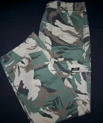 It features flex fabric. Colors: Black, Green Camo, Barley, or Olive Drab~ Fit: Relaxed~ Front: Flat. Choose From 4...