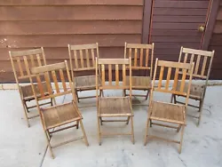 Here we have this large set of 7 antique wooden slat folding chairs, farm fresh from an Illinois district 158 park....