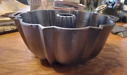 Very nice LODGE cast iron Bundt Cake Pan from around 1983 that has two dots underneath one handle that are molders...