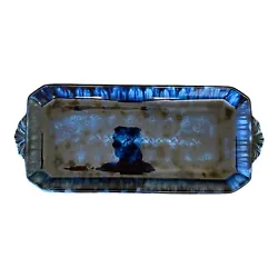 In excellent used condition with 1 small scratch. A beautiful tie-dye style blue. Size: 13x6.