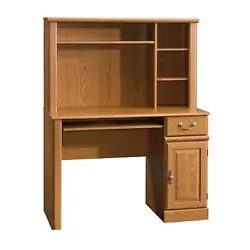 This computer desk with hutch has a Carolina Oak finish. Hutch features three adjustable shelves. Collection : Orchard...