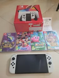 Nintendo Switch Modèle OLED HEG-001 Console Portable - 64Go - Blanc.  Vend console Nintendo Switch oled blanche...