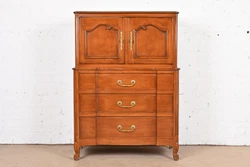 A gorgeous French Provincial Louis XV style highboy dresser or gentlemans chest. By John Stuart. Carved cherry wood,...